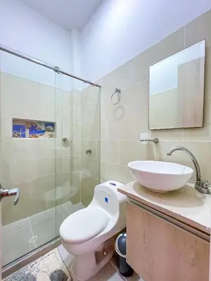 a bathroom with a toilet and a sink and a shower at Cielo Caribe 501 in Coveñas
