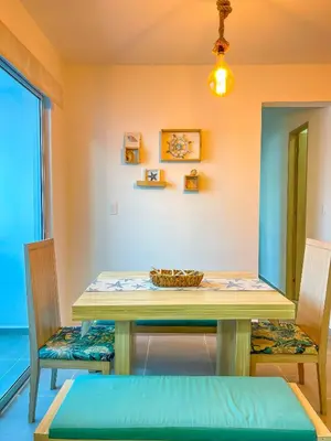 a dining room with a table and two chairs at Cielo Caribe 501 in Coveñas