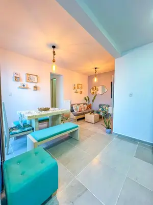 a living room with a bench and a table at Cielo Caribe 501 in Coveñas