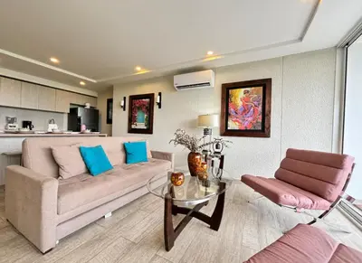 a living room with a couch and a table at 1 bedroom luxury apartment with private jaccuzi in Cartagena de Indias