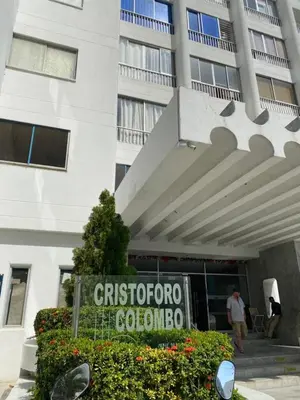 a sign in front of a building at Apartamento Cristoforo Colombo in Cartagena de Indias