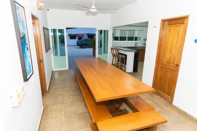 a wooden dining table in a living room at Casa La Altamar in Coveñas