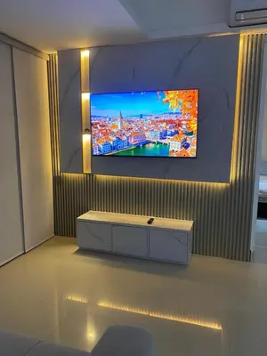 a living room with a tv on a wall at Luxury Ocean View - Bocagrande in Cartagena de Indias