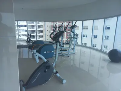 a gym with cardio equipment in a large building at Luxury Ocean View - Bocagrande in Cartagena de Indias