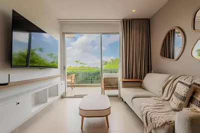 a living room with a couch and a large window at 1 k Baia Kristal lujoso y nuevo 2 alcobas Prive 2 in Cartagena de Indias
