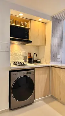 a kitchen with a stove and a microwave at Cartagena apartamento tipo loft in Cartagena de Indias