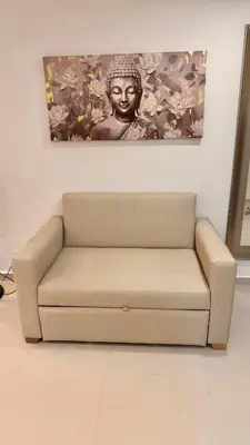 a couch in a room with a painting on the wall at Cartagena apartamento tipo loft in Cartagena de Indias