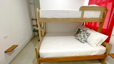 a room with two bunk beds in a room at Habitación Manglares 103 in Coveñas