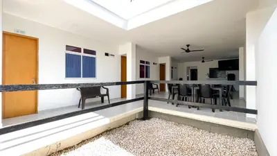 a room with a balcony with a table and chairs at Habitación Manglares 103 in Coveñas
