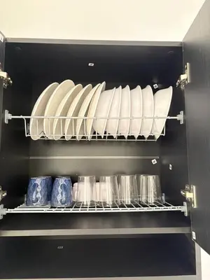 a drawer filled with plates and pans in a refrigerator at Maru Apartamentos #4 in Cartagena de Indias