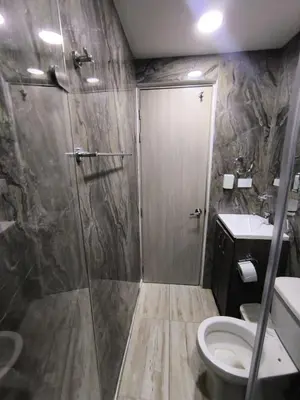 a bathroom with a shower with a toilet and a sink at Cartagena Royal Residences 903 in Cartagena de Indias