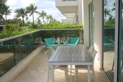 a table and chairs on the balcony of a house at Espectacular apartamento morros 3 in Cartagena de Indias