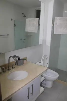 a bathroom with a sink and a toilet and a mirror at Espectacular apartamento morros 3 in Cartagena de Indias