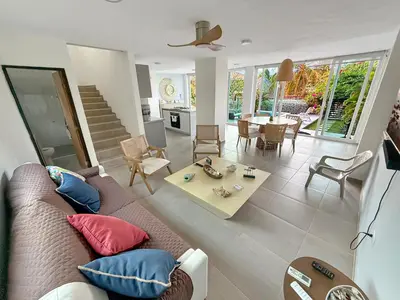 a living room with a couch and a table at Vacation Home Escape & Villa with pool in El Morro