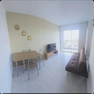 a living room with a couch and a table at Hermoso apartamento cerca a las playas de Marbella in Cartagena de Indias