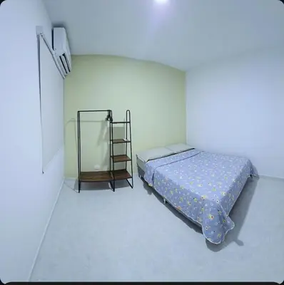 a bedroom with a bed and a ladder in it at Hermoso apartamento cerca a las playas de Marbella in Cartagena de Indias