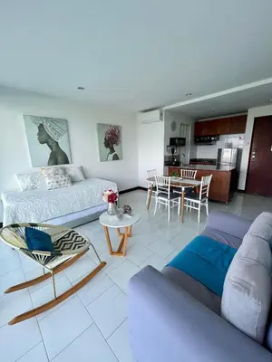 a living room with a couch and a table at Apartamento en Cartagena cerca al hotel las Américas in Cartagena de Indias