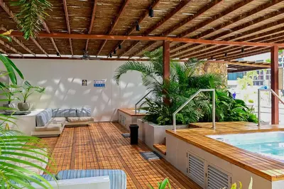 an outdoor patio with a swimming pool and a swimming at BAIA KRISTAL CARTAGENA Mi descanso ideal in Cartagena de Indias