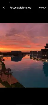 a view of a river with a sunset in the background at BAIA KRISTAL CARTAGENA Mi descanso ideal in Cartagena de Indias