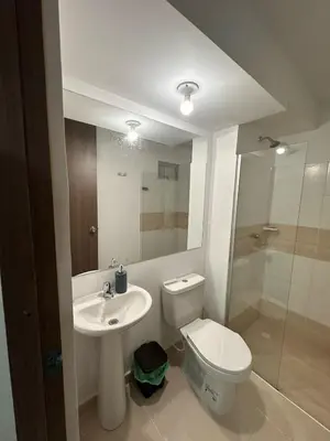 a bathroom with a toilet and a sink and a shower at Apartamento moderno en zona norte exclusiva in Barranquilla