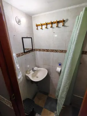 a bathroom with a sink and a shower at Tiny Room con Ventilador in Cartagena de Indias