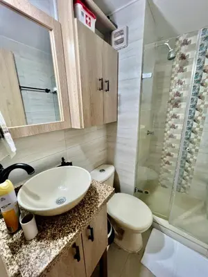 a bathroom with a sink and a toilet and a shower at Moderno apartamento con vista al mar en Cartagena in Cartagena de Indias