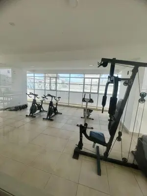 a gym with several tread machines in a room at Moderno apartamento con vista al mar en Cartagena in Cartagena de Indias