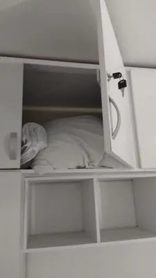 a white book shelf with a pillow in it at Moderno apartamento con vista al mar en Cartagena in Cartagena de Indias