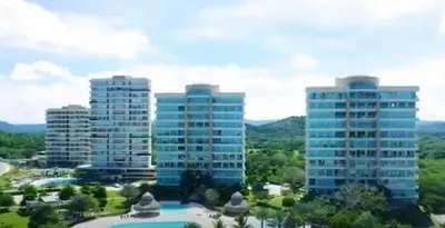 a group of tall buildings in a city at Resort frente al mar in Juan de Acosta