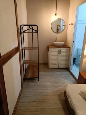 a bathroom with a sink and a mirror at Mar Barú Beach House in Playa Blanca