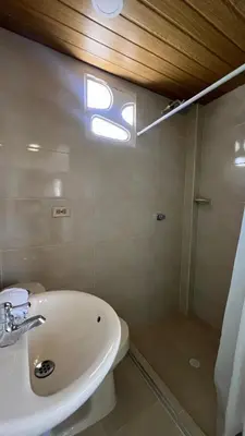 a bathroom with a sink and a shower at Apartamento 6 pax in Estación El Salto