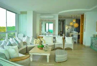 a living room with a couch and a table at Magico Apartamento Frente al Mar 3 Habitaciones CV41 in Coveñitas
