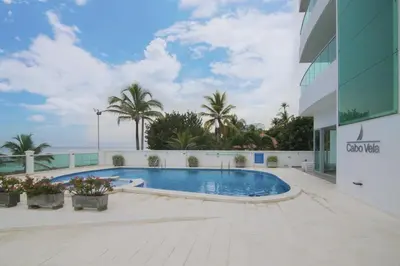 a swimming pool in front of a building at Magico Apartamento Frente al Mar 3 Habitaciones CV41 in Coveñitas