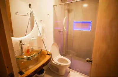 a bathroom with a sink and a toilet and a shower at Cartagena Vibes House in Cartagena de Indias