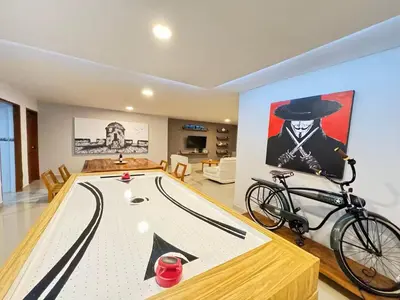 a ping pong table with a bike in a room at Cartagena Vibes House in Cartagena de Indias