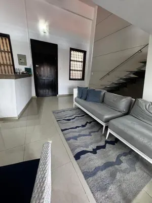a living room with a couch and a rug at Luxury 2B Duplex in Old City Cartagena in Cartagena de Indias