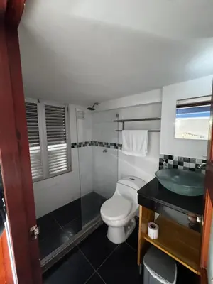 a bathroom with a toilet and a sink at Luxury 2B Duplex in Old City Cartagena in Cartagena de Indias