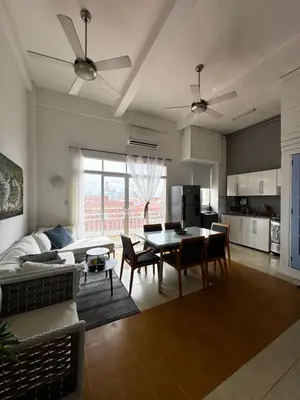 a living room with a couch and a table at Luxury Loft in Old City Cartagena - 5th in Cartagena de Indias
