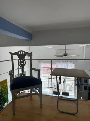 a chair sitting in a room with a table at Luxury Loft in Old City Cartagena - 5th in Cartagena de Indias