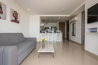 a living room with a couch and a table at 1004 Morros City - Spectacular 1 Bedroom Condo in Cartagena de Indias