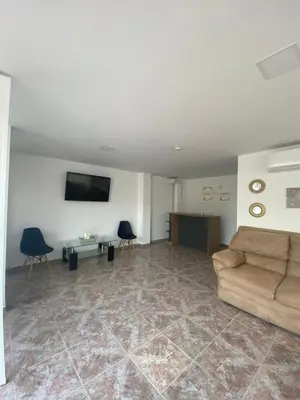 a living room with a couch and a table at Hotel Boutique DL in Cartagena de Indias