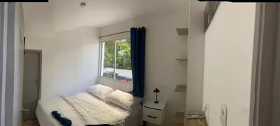 a small bedroom with a bed and a window at Hotel Boutique DL in Cartagena de Indias