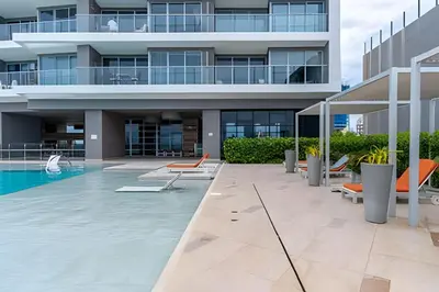 an image of a building with a swimming pool at Hermoso Apto 2 Hab Piso 11 en Morros City in Cartagena de Indias
