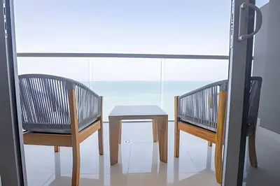 two chairs and a table in front of a window at Hermoso Apto 2 Hab Piso 11 en Morros City in Cartagena de Indias