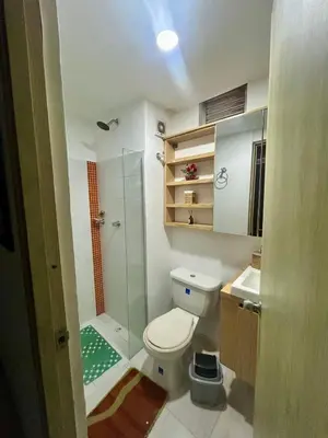 a bathroom with a shower and a toilet and a sink at Apartamento Playas de Marbella in Cartagena de Indias