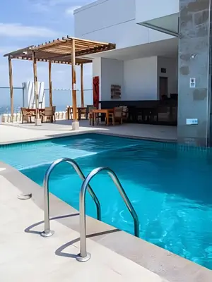 a swimming pool with a view of a building at Espectacular Apto 3 Hab Palmetto Beach 1201 in Cartagena de Indias