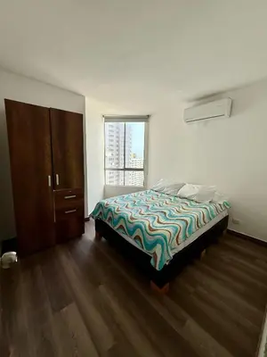 a bedroom with a bed and a large window at Casa Ingrid in Cartagena de Indias