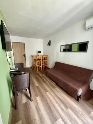 a bedroom with a bed and a desk with a computer at Casa Ingrid in Cartagena de Indias