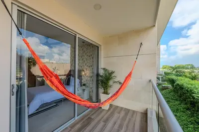 a hammock hangs from the balcony of a house at Ubicación soñada en Cartagena | Apartamento premium en Baia Kristal in Cartagena de Indias