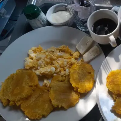 a white plate with food on a table at Mango Beach in San Bernardo del Viento
